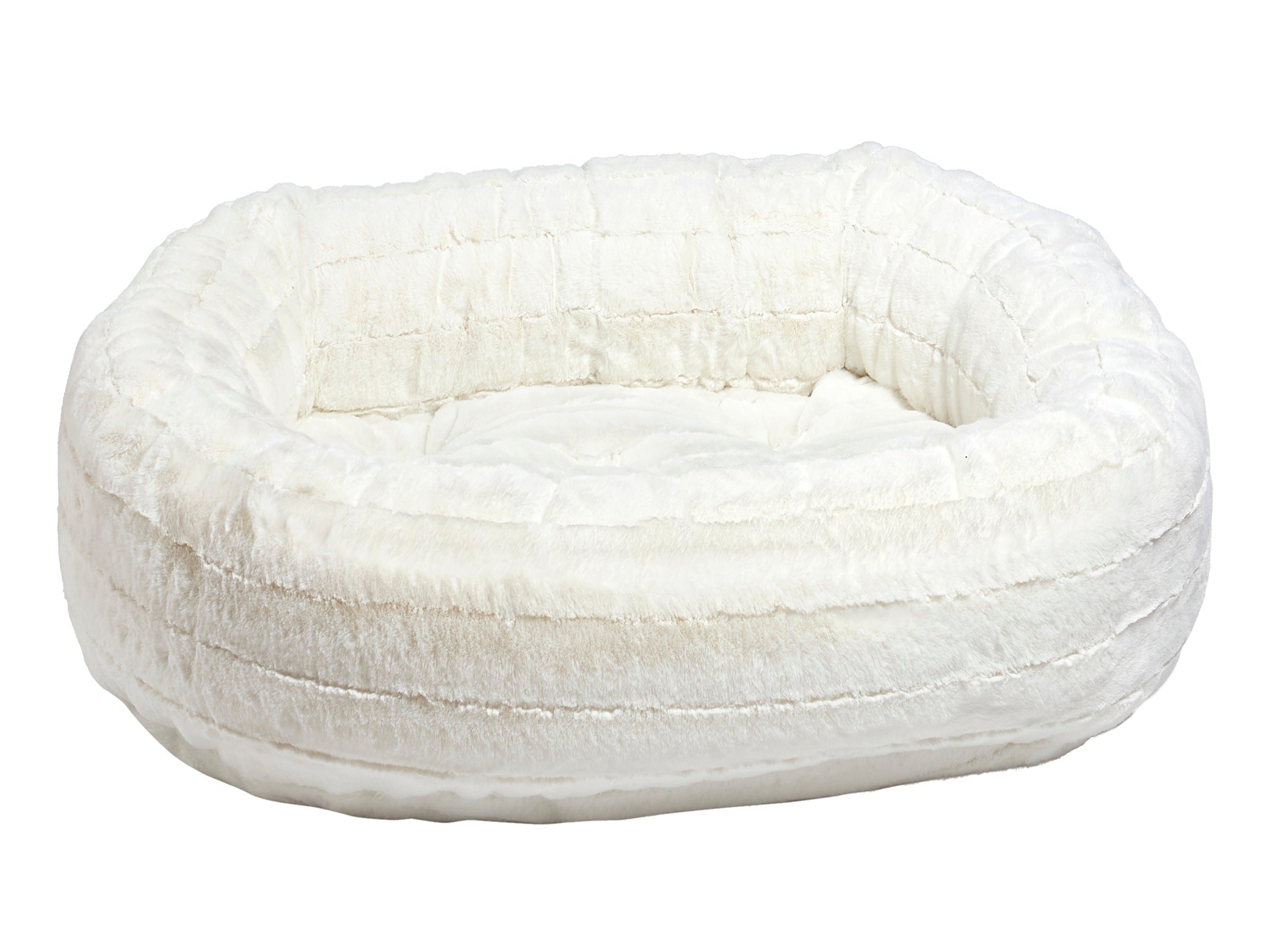 A plush, round pet bed in a warm off-white or cream color, featuring a quilted texture and a soft, cushioned interior, shown against a plain white background.