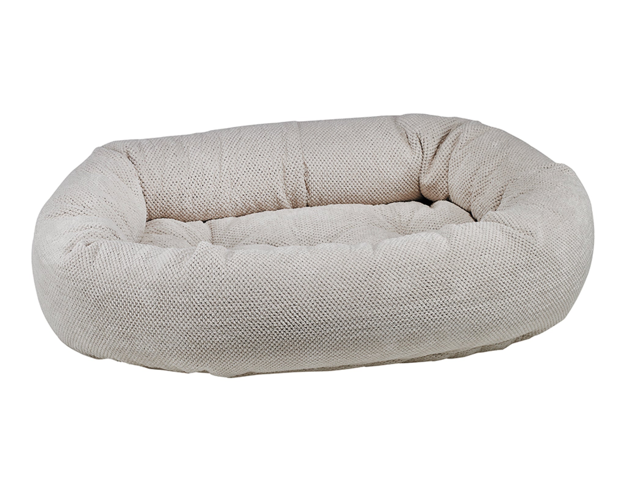 Dog bed with textured surface on a white background