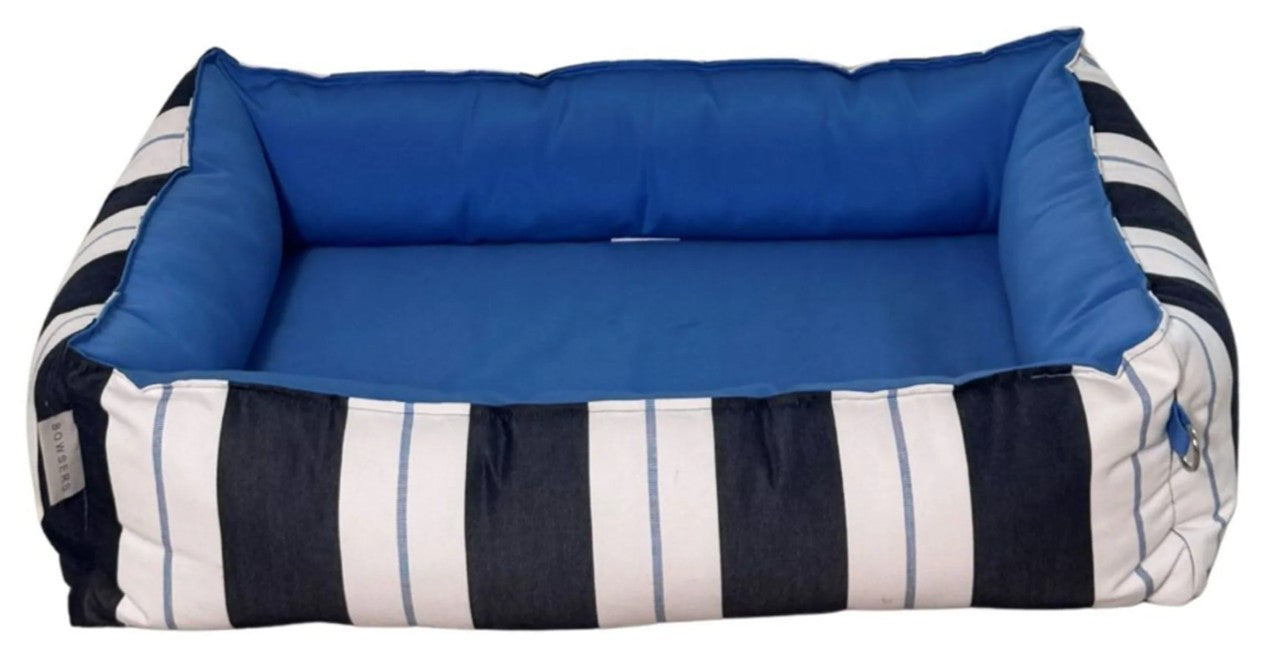 A rectangular pet bed with a bright blue cushioned interior and a striped exterior featuring navy, white, and light blue vertical stripes.