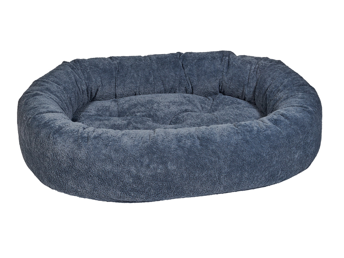 Blue pet donut bed on a white background