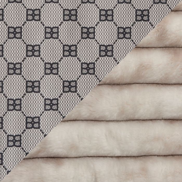 A close-up of a luxury material sample, likely Gucci's GG Supreme canvas paired with mink, split diagonally. The left side shows the classic beige and black geometric monogram pattern, while the right side displays the soft, plush beige mink fur texture.
